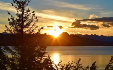 Golden sunset against mountains in Alaska